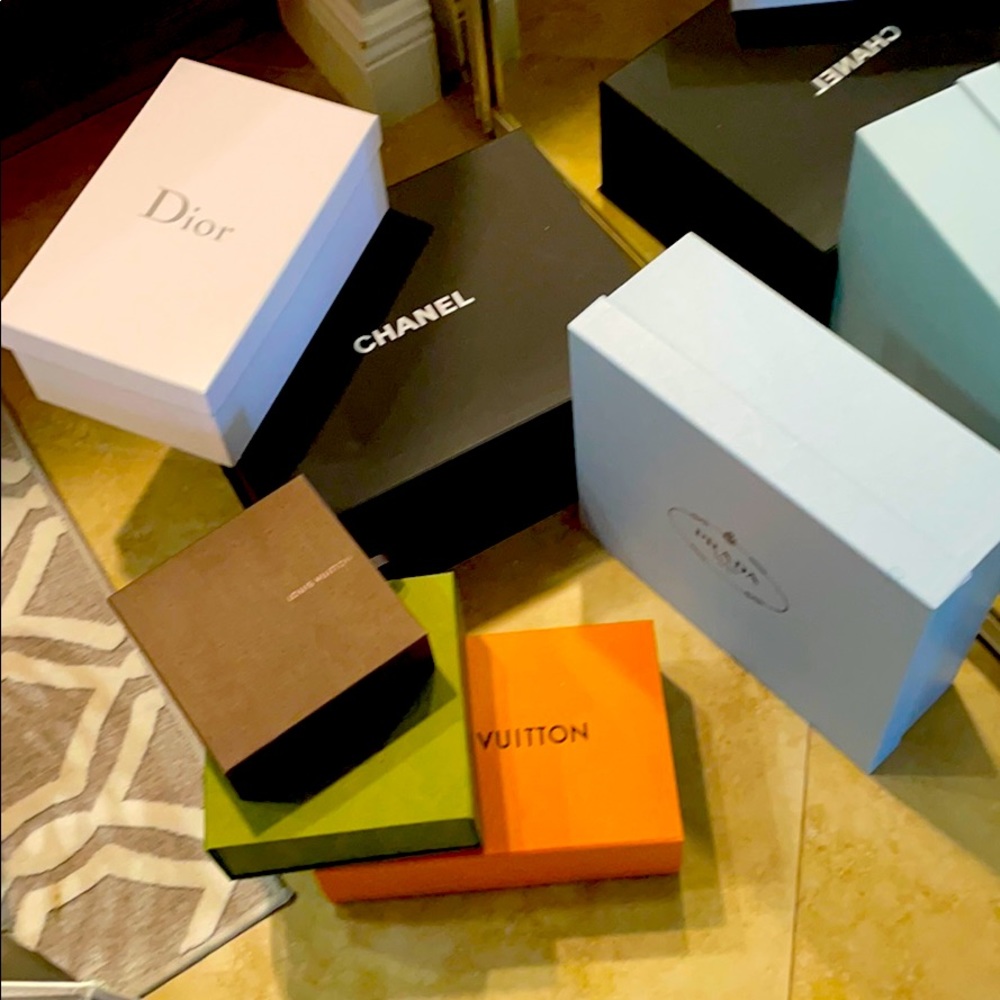 Various designer shoe and handbag boxes.